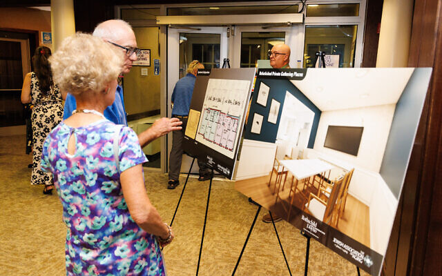 Attendees of the Sept. 2 annual meeting observe renderings of Weinberg Terrace. (Photo courtesy of Jewish Association on Aging)