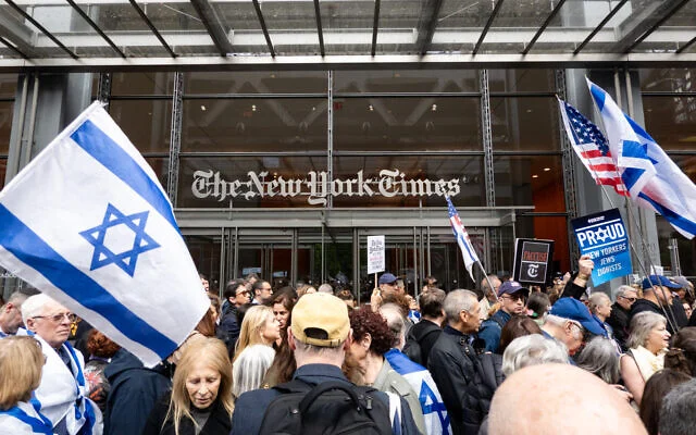 Protesters outside The New York Times offices in New York City, May 14, 2026. (Luke Tress/Times of Israel)