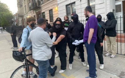 Protesters from Crown Heights Bites Back shove a Jewish man at a rally in Crown Heights, Brooklyn, August 19, 2025. (Luke Tress/Times of Israel)
