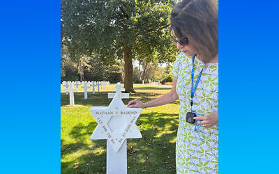 Toby Tabachnick at the gravesite of WWII soldier Nathan Baskind, a Pittsburgher (Photo by Gene Tabachnick)