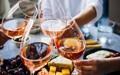 Glasses of rosé wine seen during a friendly party of a celebration. (Photo by  gregory_lee via iStock)