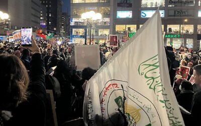 A protester holds a Pro-Palestinian protesters overwhelm the area of New York City's Union Square where an Israeli peace group planned to hold an Oct. 7 vigil on Oct. 7, 2026. (Joe Strauss/JTA)