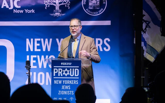 New York City Comptroller-elect Mark Levine addresses a crowd outside Park East Synagogue, in New York City, December 4, 2025. (Luke Tress/Times of Israel)