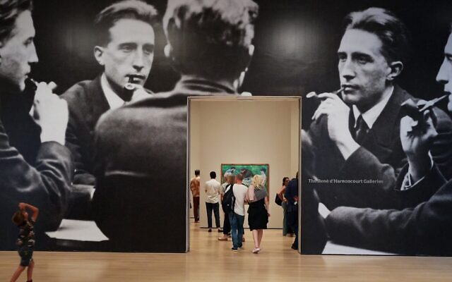 Visitors walk past an enlarged reproduction of 'Five-Way Portrait of Marcel Duchamp' on August 20, 2026 at the Museum of Modern Art in New York, NY. (Liao Pan/China News Service/VCG via Getty Images)
