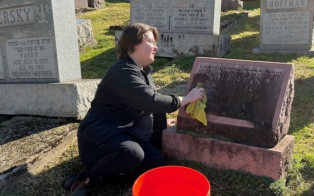 In preparation of Oct. 27, a volunteer helps clean a cemetery. (Photo courtesy of Jewish Cemetery & Burial Association) In preparation of Oct. 27, a volunteer helps clean a cemetery. (Photo courtesy of Jewish Cemetery & Burial Association)
