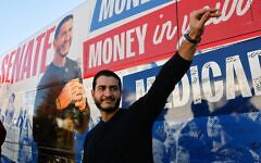 Abdul El-Sayed, U.S. Democratic Senate candidate from Michigan, waves to supporters near his campaign bus after a rally in Flint, Michigan, Oct. 18, 2026. (JEFF KOWALSKY / AFP)