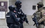 Members of Serbia's Gendarmerie stand guard at the entrance to the Israeli embassy in Belgrade, Oct. 28, 2026. (Andrej ISAKOVIC / AFP)