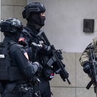 Members of Serbia's Gendarmerie stand guard at the entrance to the Israeli embassy in Belgrade, Oct. 28, 2026. (Andrej ISAKOVIC / AFP)