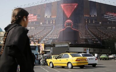 A giant anti-Israel and anti-Netanyahu billboard is displayed at Enghelab Square in Tehran as tensions between Iran and the United States and Israel continue, on October 12, 2026 in Tehran, Iran. The billboard depicts Israeli Prime Minister Benjamin Netanyahu addressing an empty hall and carries Persian messages reading, 'More isolated with each passing day' and 'Al-Aqsa Flood is a definite defeat for the Zionist regime.' (Fatemeh Bahrami/Anadolu via Getty Images)