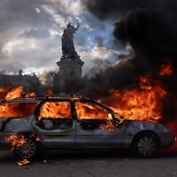 A car is set ablaze during demonstrations on October 17, 2026 in Paris, France. (Photo by Carl Court/Getty Images)