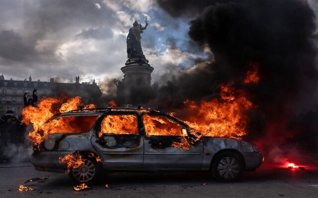A car is set ablaze during demonstrations on October 17, 2026 in Paris, France. (Photo by Carl Court/Getty Images)