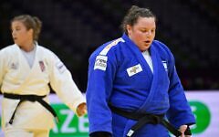 Israel's Raz Hershko reacts after defeating Croatia's Helena Vukovic (white) in the women's over 78 kg bronze medal bout at the World Judo Championships in Baku on October 10, 2026. (Alexander NEMENOV / AFP via Getty Images)