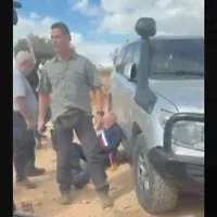 Screenshot from video of diplomats attacked by settler extremists in the Taybeh area of the West Bank, October 17, 2026. (Doron Kadash / Army Radio via X, from The Times of Israel)