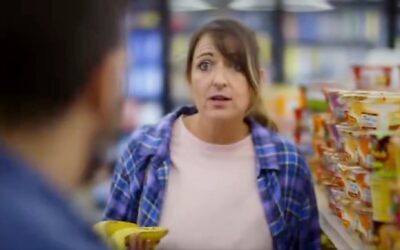 Actors playing a couple in a grocery store blame Israel for high prices in a campaign ad meant to support Michigan Democrat Abdul El-Sayed, paid for by the left-wing Rebellion PAC, Oct. 26, 2026. (Screenshot via X)