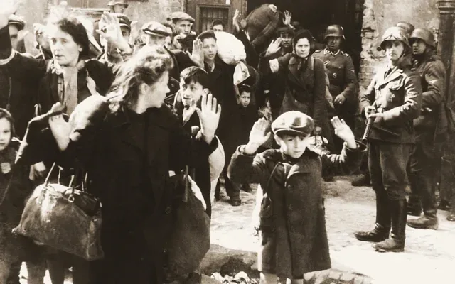 One of the most famous pictures of Jews being rounded up by Nazi Germans during the Holocaust, this from the Warsaw Ghetto Uprising in May 1943. (Credit: Wikimedia Commons)