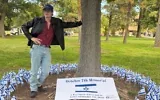 Lawrence Puccini with his Oct. 7 memorial at the University of New Mexico, Oct. 7, 2026. (Credit: Courtesy, via JNS)