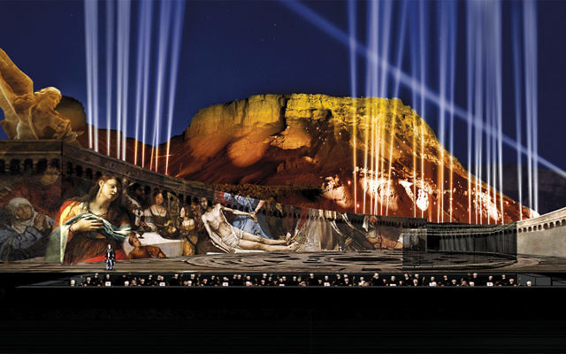 Mount Masada shimmers in the night sky as the stage is set for ‘Tosca.”