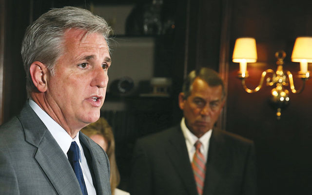 House Majority Leader Kevin McCarthy speaks at Republican Party headquarters in Washington  July 22. House Speaker John Boehner is in the background. (Mark Wilson/Getty Images)