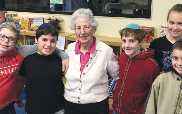 Renia Schustermann is pictured with some of the GBDS sixth-graders.