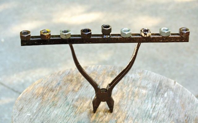 Pliers and some nuts find new life as a menorah.