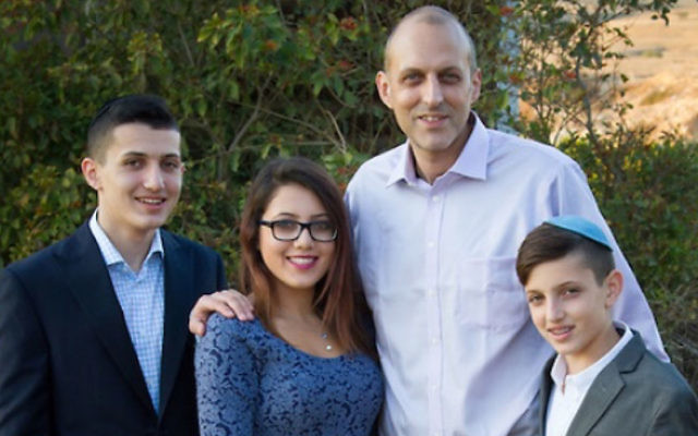 Jay Engelmayer with three of his children, from left, Immanuel, Tehilla, and Tibor. The photograph was taken on Tibor’s bar mitzvah weekend in mid-December. (Courtesy Debbie Zimelman)