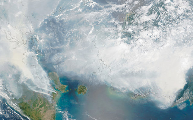 A NASA image taken on September 24, 2015, from the Moderate Resolution Imaging Spectroradiometer (MODIS) on the Terra satellite shows smoke from fires in Indonesia over the coasts of Borneo and Sumatra.