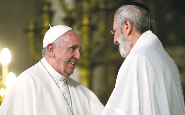 Pope Francis, left, greeting the chief rabbi of Rome, Riccardo Di Segni, during the pope’s visit to the city’s Great Synagogue on January 17. (Franco Origlia/Getty Images)