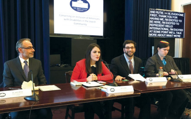 Dr. John Winer, left, director of the Jewish Association for Developmental Disabilities, joins participants at a White House conference on the inclusion of people with disabilities into the Jewish community.