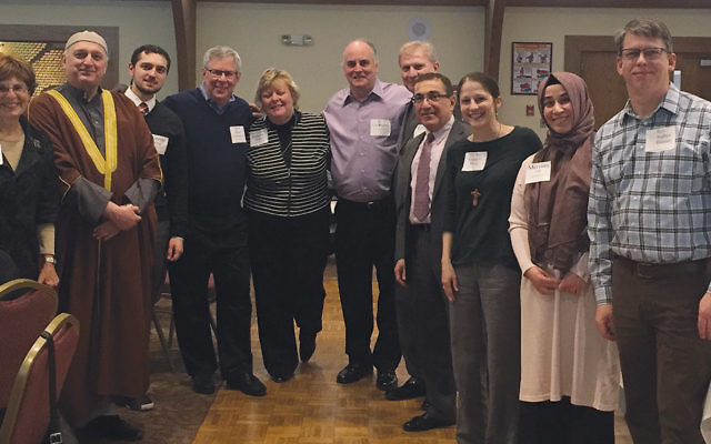 Before dinner, from left, Barnert’s Rabbi Elyse Frishman, Imam Moutaz and Ammar Charaf, both of the Elzahra Islamic Center in Midland Park;  Rabbi Daniel Freelander, president of the World Union for Progressive Judaism; Rev. Kathryn L. King of St. Albans Episcopal Church and Rev. Lou Kilgore of High Mountain Presbyterian Church, both in Franklin Lakes; the Peace Institute’s Ercon Tozan; Mahomoud Hamza of the Elzahra Islamic Center; Rev. Alison V. Philip of the United Methodist Church in Franklin Lakes; Meryem Teke of the Peace Institute, and Rev. Nathan Busker of Ponds Reformed Church in Oakland stood together.