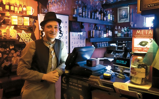 Vlodymir, a waiter at the Pid Zolotoju Rozoju restaurant, calls himself Moishe. (Canaan Liphshiz)
