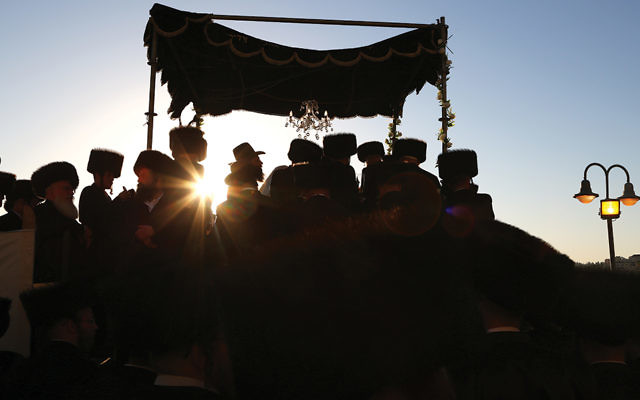 Chasidic men celebrate a wedding in Israel, where marriage and divorce are legally under the authority of the Orthodox chief rabbinate. (Yaakov Lederman/Flash90)
