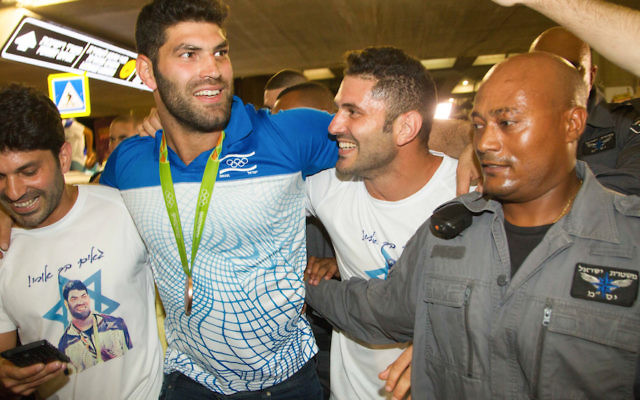Israeli Judo olympic medalist Ori Sasson arrives to Ben Gurion international airport in Tel Aviv on August 15, 2016. Photo by Roy Alima/Flash90 Israeli Judo olympic medalist Ori Sasson arrives to Ben Gurion international airport in Tel Aviv on August 15, 2016. Photo by Roy Alima/Flash90