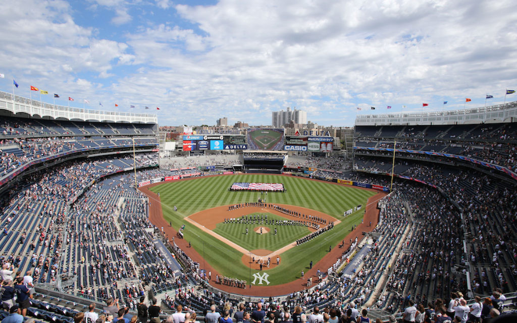 In the shadow of stadium, a Yemen-born Yankee vendor waits out