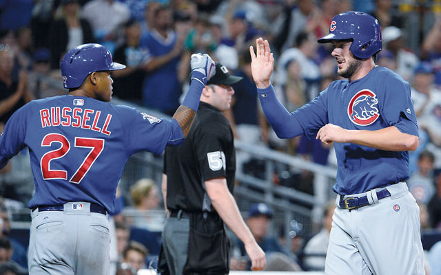 Cubs Addison Russell, left, and Kris Bryant during the fifth inning of a game against the Padres at Petco Park in San Diego on August 23. (Denis Poroy/Getty Images)
