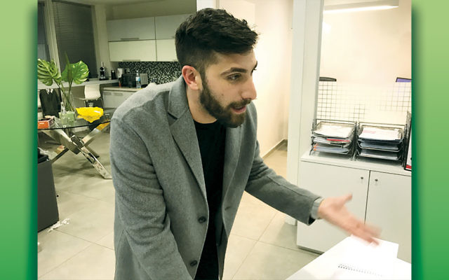 Austin Smith, a co-founder of Wealth Recovery International, speaking at the company’s office in Tel Aviv in February. (Andrew Tobin)