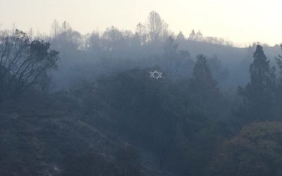 Surrounded by blackened vegetation, Camp Newman’s iconic hillside Star of David survived a wildfire in Northern California. (Courtesy of URJ Camp Newman)