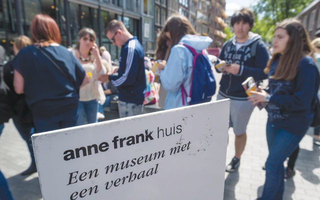 Tourists line up outside the Anne Frank house in Amsterdam. (Lex Van Lieshout/AFP/Getty Images)