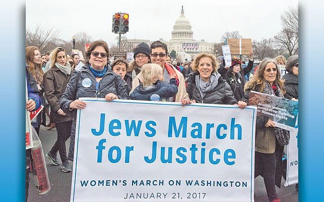 It was different last year. 
From left, Nancy Kaufman, CEO of the National Council of Jewish Women; Rabbi Tamara Cohen, chief of innovation at Moving Traditions, and Debbie Hoffmann, NCJW’s board president, at the National Mall for the Women’s March on Washington on January 21, 2017. (Ron Sachs)