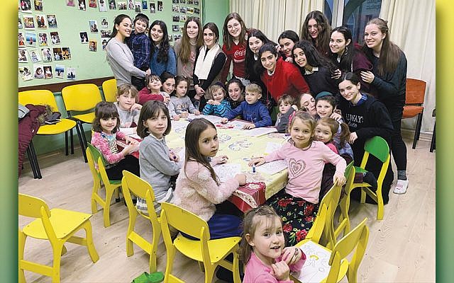 Students from Ateres Bais Yaakov Rockland in Hempstead, N.Y., pose with their charges at the orphanage run by Tikva in Odessa, Ukraine.