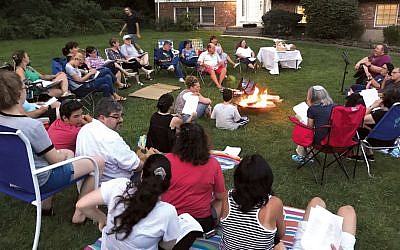 On Tu b’Av — it started on the evening of August 15 this year — people gathered around a bonfire in front of Rabbi Scheff’s house on the Orangetown Jewish Center campus as evening drew in. (Rabbi Craig Scheff)