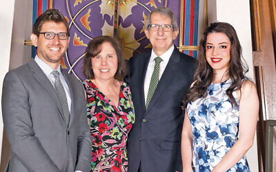 Two months before the transplant, when Ronald Roth’s shul honored him, Rabbi Roth stands with his family — his son, Gabe; his wife, Rhonda, and his daughter, Deena. (Courtesy Rabbi Roth)