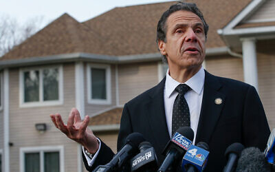 Andrew Cuomo talks to reporters outside Rabbi Chaim Rottenberg’s house in Monsey on December 29, 2019. (Kena Betancur/AFP via Getty Images)