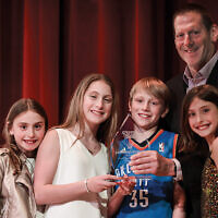 Danny Rubin stands behind four of his grandchildren; from left, they’re Eden Canarick, Charlotte Rubin, Lenny Rubin, and Mia Canarick. The children are honoree Leonard Rubin’s great-grandchildren.