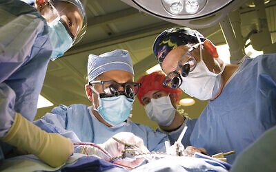 Dr. Herbert Dardik, right, leads of team working to fix an aneurysm at Englewood Health. (ENGLEWOOD HEALTH)