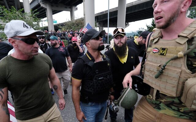 Far-rightists from the Proud Boys wait to get into vehicles after marching across the Hawthorne Bridge in Portland, Ore., Aug. 17, 2019. (Alex Milan Tracy/Anadolu Agency via Getty Images)