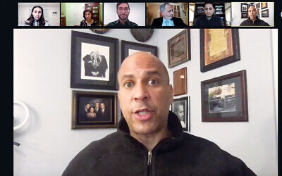 Cory Booker talks to students at the Kushner/St. Benedict’s program; Deborah Oren, second from left, and Rabbi Rubin, third from right, and students listen to him.