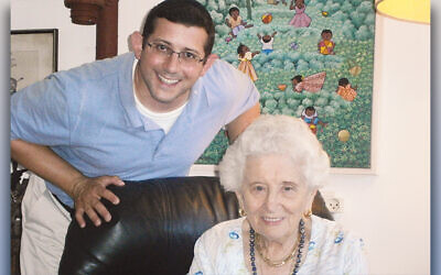 Jonathan Milgram stands behind Ruth Dayan, who died in February, just before she was to turn 104.