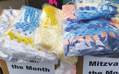 TBA congregant Ruth Dolinko knitted blankets to be used as lap blankets for the elderly or as baby blankets.