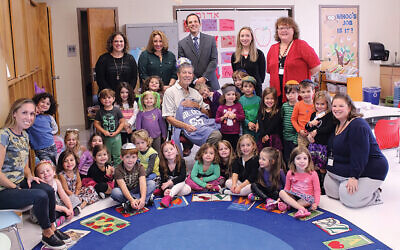 Preschoolers, kindergarteners, and their teachers celebrate Dr. Och’s 85th birthday in 2016; Dr. Och is in the center, and Adam Shapiro stands behind him.