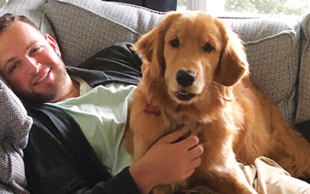 Rob relaxing with the family dog.
